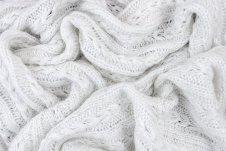 Background of white crumpled woolen fabric.の写真素材
