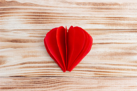Craft paper heart in the palms for Valentine's Day. step by step instruction. DIY gift.の写真素材
