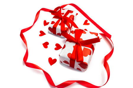 Gift boxes with red hearts on a white background. The concept of gifts for Valentine's day. Shopping, sales and discount concept.の写真素材