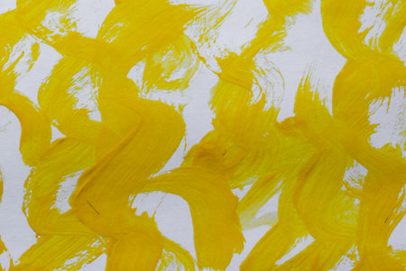 abstract painting. Yellow wavy lines on canvas. background design.の写真素材