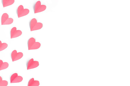Background with paper hearts with free space for text on a white background. Valentine's day concept. copyspace. Flat lay, top view.の写真素材