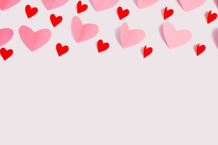 Pink and red hearts on a white background. Flat layout, top view. copyspace. Valentine's day concept.の写真素材