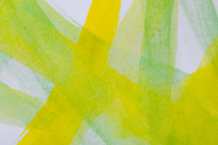 abstract art. Yellow and light green lines of watercolor on white canvas. background for designers.の写真素材