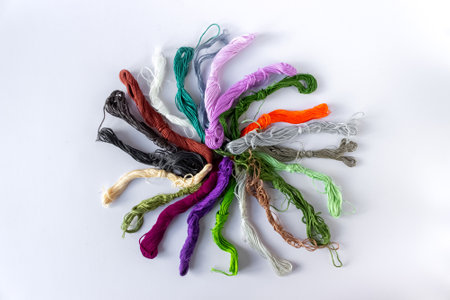 A set of multicolored threads for embroidery in a heap. Needlework concept.
