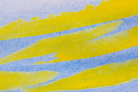 The background for designers is made of watercolor paint on canvas. Yellow-blue lines.の写真素材