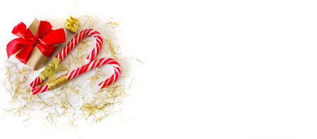 Festive gift boxes with caramel staff on a white background. New Year and Christmas concept. Postcard, invitation, banner. view from above. copyspace.の写真素材