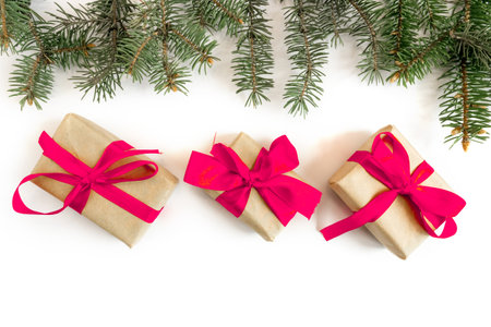 Festive gift boxes with spruce branches on a white background. The concept of New Year and Christmas. flatlay. postcard.の写真素材