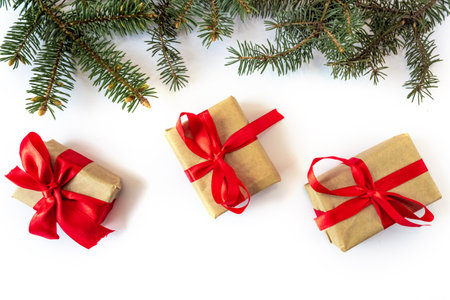 Festive gift boxes with spruce branches on a white background. The concept of New Year and Christmas. flatlay. postcard.の写真素材