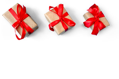 Gift boxes with a red bow on a white background. Banner. copyspace. flat lay. top view. The concept of any holiday.の写真素材