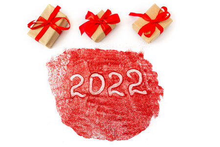 Festive gift boxes with the inscription 2022. White background. The concept of New Year and Christmas.の写真素材