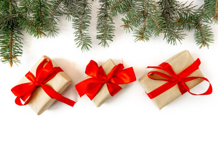 Festive gift boxes with spruce branches on a white background. The concept of New Year and Christmas. flatlay. postcard.の写真素材