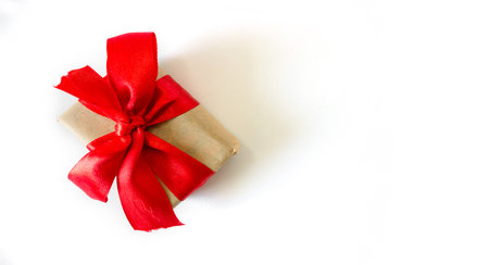 Holiday gift box with red ribbons on a white background. Concept for New Year, Valentine's Day. postcard, invitation. view from above. copyspace.の写真素材