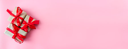 Gift box with ribbon on a pink background with place for text. view from above. flat lay. copyspace.の写真素材