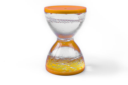 Yellow water clock on a white background. The concept of time. The subject of decor.の写真素材