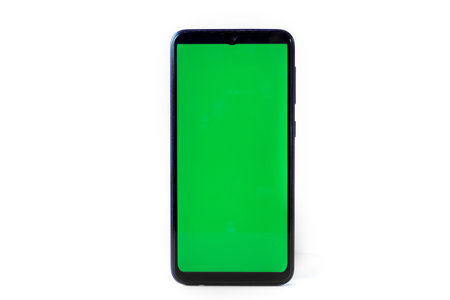 Smartphone in a vertical position with a green screen on a white background. Chrome key. Mock up.の写真素材