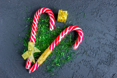 Caramel staff on a concrete background. New Year and Christmas concept. postcard. view from above.の写真素材