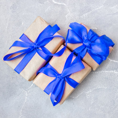 Gift boxes with a pink bow on concrete background. Banner. flat lay. top view. The concept of any holiday.の写真素材