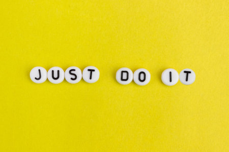 The inscription Just do it on a yellow background. The concept of motivation, ideas, inspiration.の写真素材