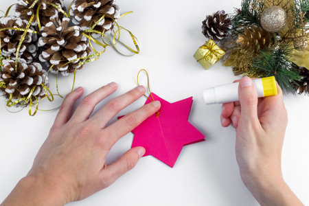 3D star made of colored paper. Step by step photo instructions. DIY concept. Children's Christmas and New Year's crafts. Step 8の写真素材