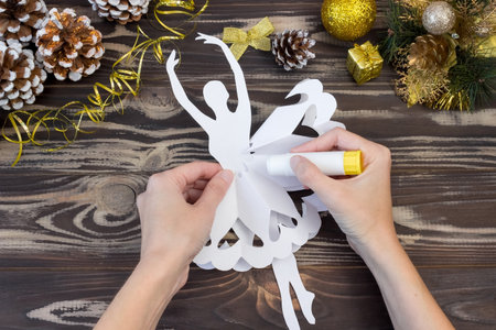 Snowflake ballerina paper. Step by step photo instructions. DIY concept. Children's Christmas and New Year's crafts. Step 12の写真素材