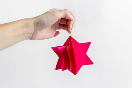 3D star made of colored paper. Step by step photo instruction. DIY concept. Children's Christmas and New Year's crafts. final result.の写真素材