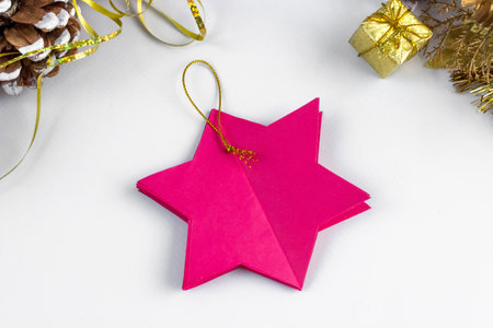 3D star made of colored paper. Step by step photo instruction. DIY concept. Children's Christmas and New Year's crafts. Step 7の写真素材