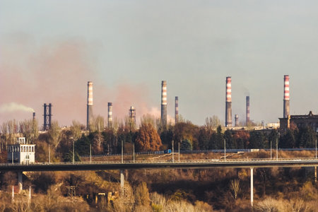Emission of smoke from pipes of a metallurgical plant. The problem of air pollution and global warming. environmental protection concept. Zaporozhye, Ukraine.の写真素材