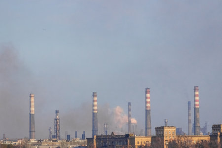 View of the industrial city of Zaporozhye, Ukraine. Smog emissions from chimneys, air pollution. Poor environmental situation. Metallurgical factories.の写真素材