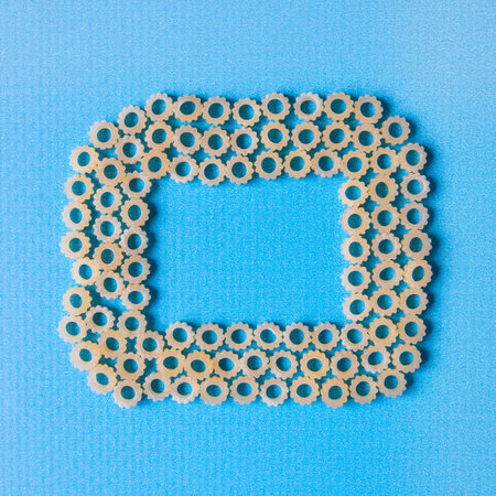Figure pasta on a blue background. Space for text.の写真素材