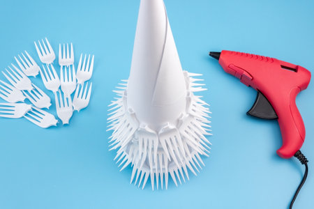 How to make a creative Christmas tree from plastic disposable forks. Step by step photo instructions. Handmade, DIY. Reusable and zero waste concept.の写真素材