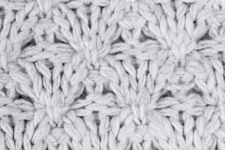 Large knitting of a white wool sweater. texture and background.の写真素材
