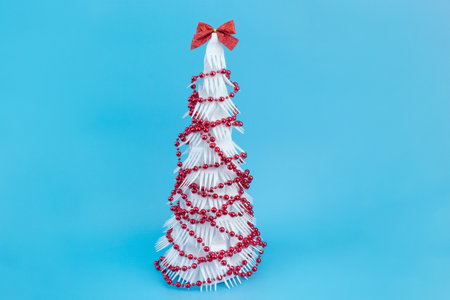 How to make a creative Christmas tree from plastic disposable forks. Step by step photo instructions. Handmade, DIY. Reusable and zero waste concept. final result.の写真素材