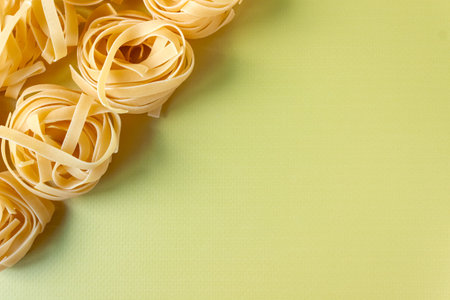 Green background with raw spaghetti. view from above. Space for text.の写真素材