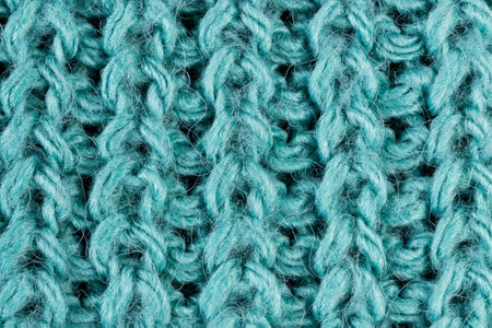 Texture of green knitted woolen fabric close up.の写真素材