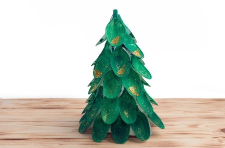 Christmas tree made of disposable spoons. step by step instruction. Handmade, DIY. Plastic recycling concept.の写真素材
