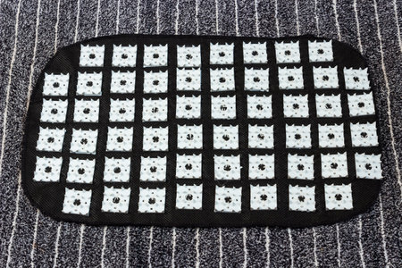 Acupuncture mat for feet. acupressure treatment. healthy lifestyle. cosmetic procedures.の写真素材