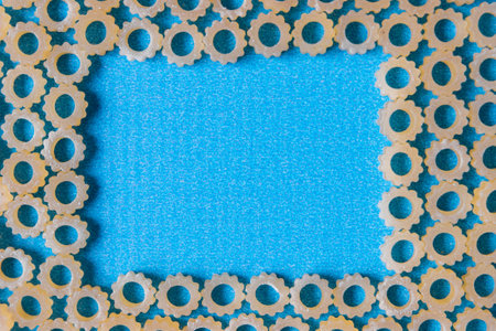Figure pasta on a blue background. Space for text.の写真素材