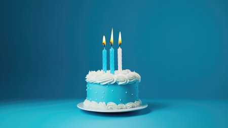 A festive dessert for a celebration, featuring a buttercream cake with candles on a blue background.の素材