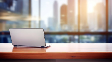 City view from a modern office with laptop on the table, empty space.の素材