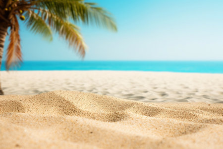 A tranquil tropical bay: palm trees, turquoise sea, and sand under the sun.の素材