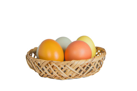 Easter eggs decoration in wicker basket, isolated on transparent background - cultural symbol.の素材