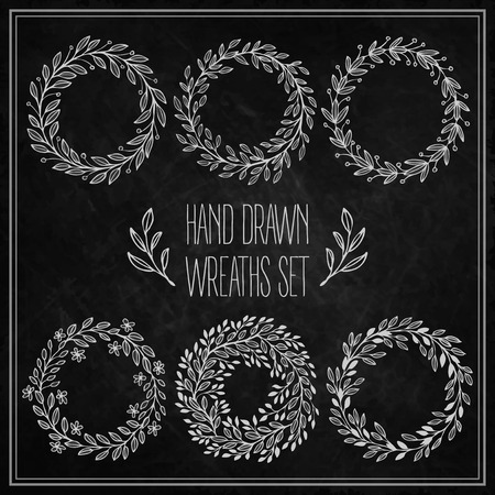 Set of decorative wreaths drawn in chalk on a blackboard. Vector illustration のイラスト素材
