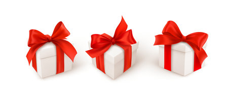 Set of three white gift boxes with red silk ribbon bow isolated on white background. Vector illustrationのイラスト素材