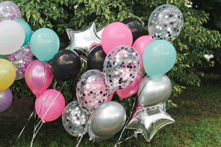 Colorful birthday balloons. Pink, deep, black, silver