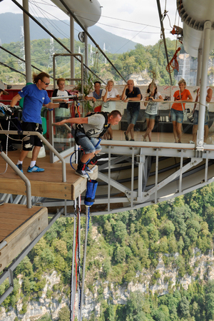 Russia, Sochi, Skypark - August 16, 2014: A man jumping with bungee, jump from a height of 69 metres from a special platform, which is located at the bridge Skybridgeのeditorial素材