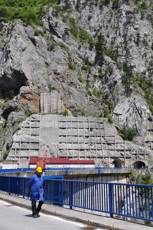 Martinovski HPP, Montenegro - May 31, 2014: The employee - engineer to work on hydroelectric Martinovski, which is on the river of Pivaのeditorial素材