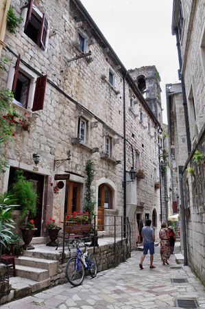 Montenegro, Kotor - May 29, 2014: The ancient streets of Kotor, a bicycle and peopleのeditorial素材