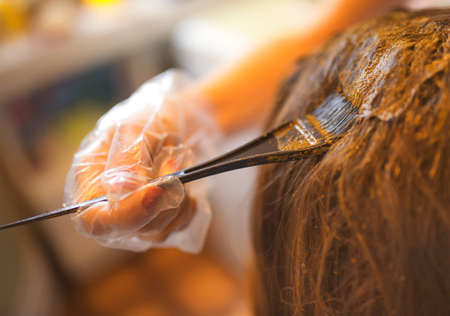 Process of coloring hair with natural henna.の写真素材