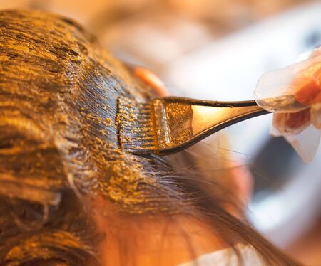 Process of coloring hair with natural henna.の写真素材