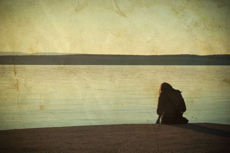 Alone by the sea on vintage backgroundの写真素材
